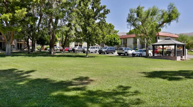 an aerial view of a house with swimming pool garden and patio