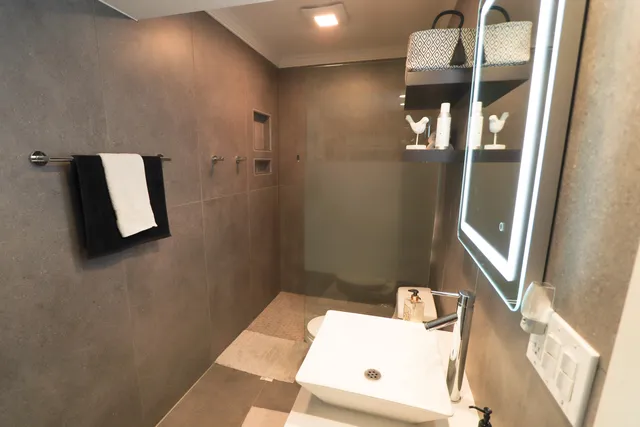 a bathroom with a sink and mirror