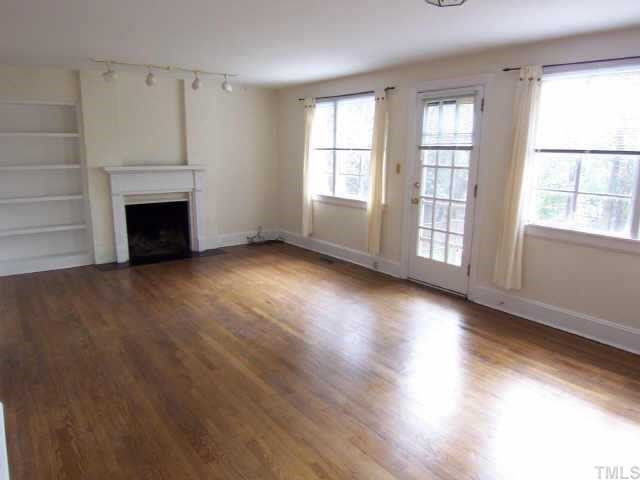 712 East Whitaker Mill Road Raleigh, NC 27608 - Photo 2 of 12 Large living/dining combination with fireplace and built-ins. Other