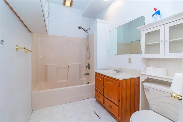 a bathroom with a sink a vanity and a mirror