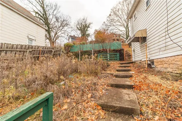 a backyard of a house with lots of green space