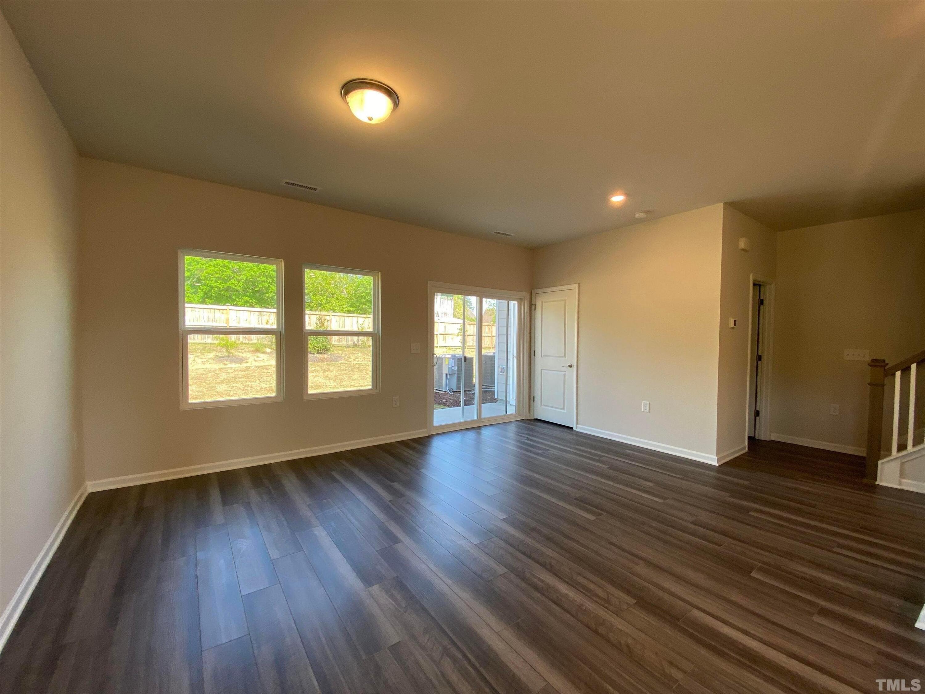 908 Clearhaven Lane Fuquay-Varina, NC 27526 - Photo 16 of 23 a view of an empty room with wooden floor and a window