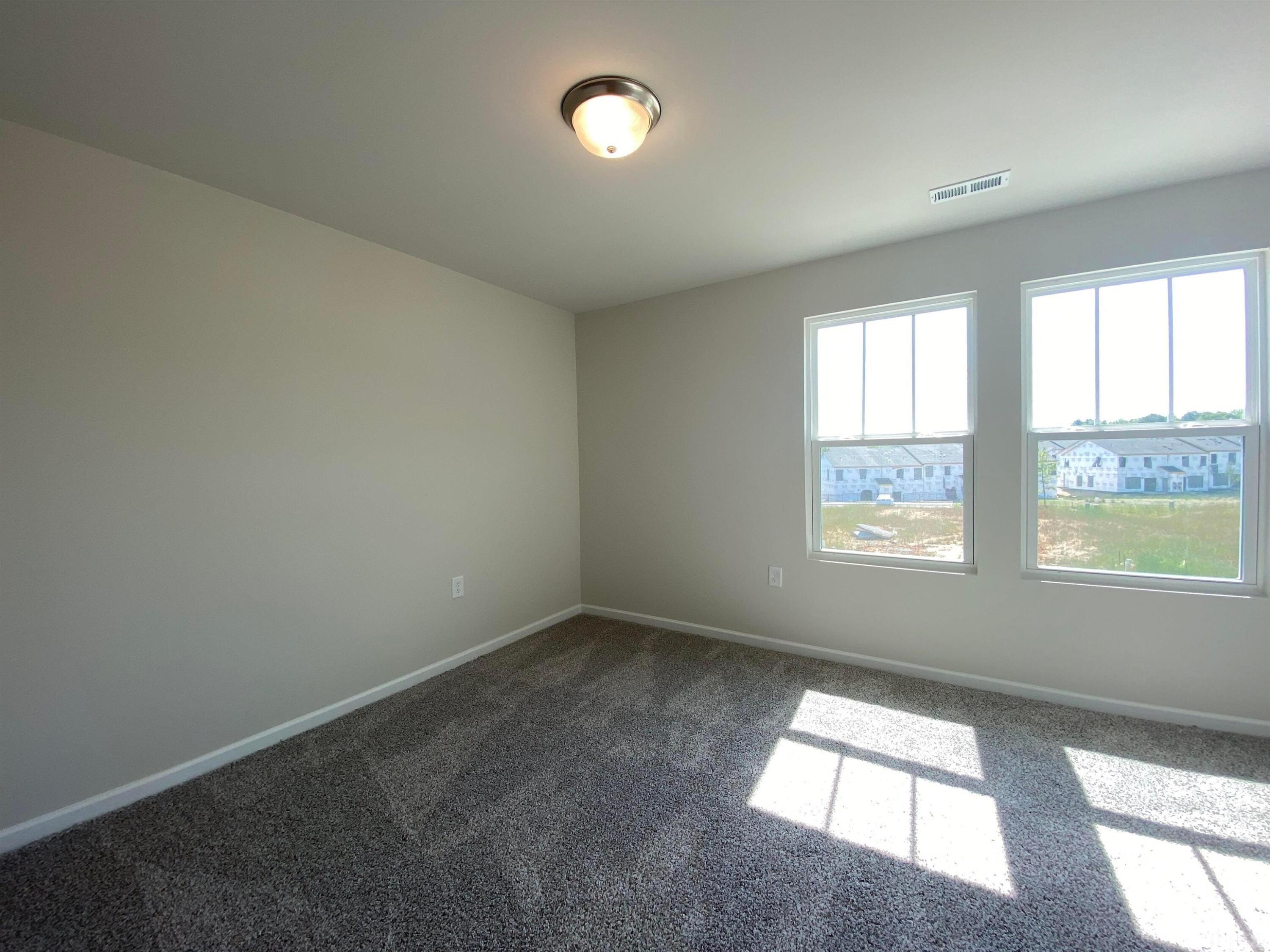 908 Clearhaven Lane Fuquay-Varina, NC 27526 - Photo 22 of 23 an empty room with a window