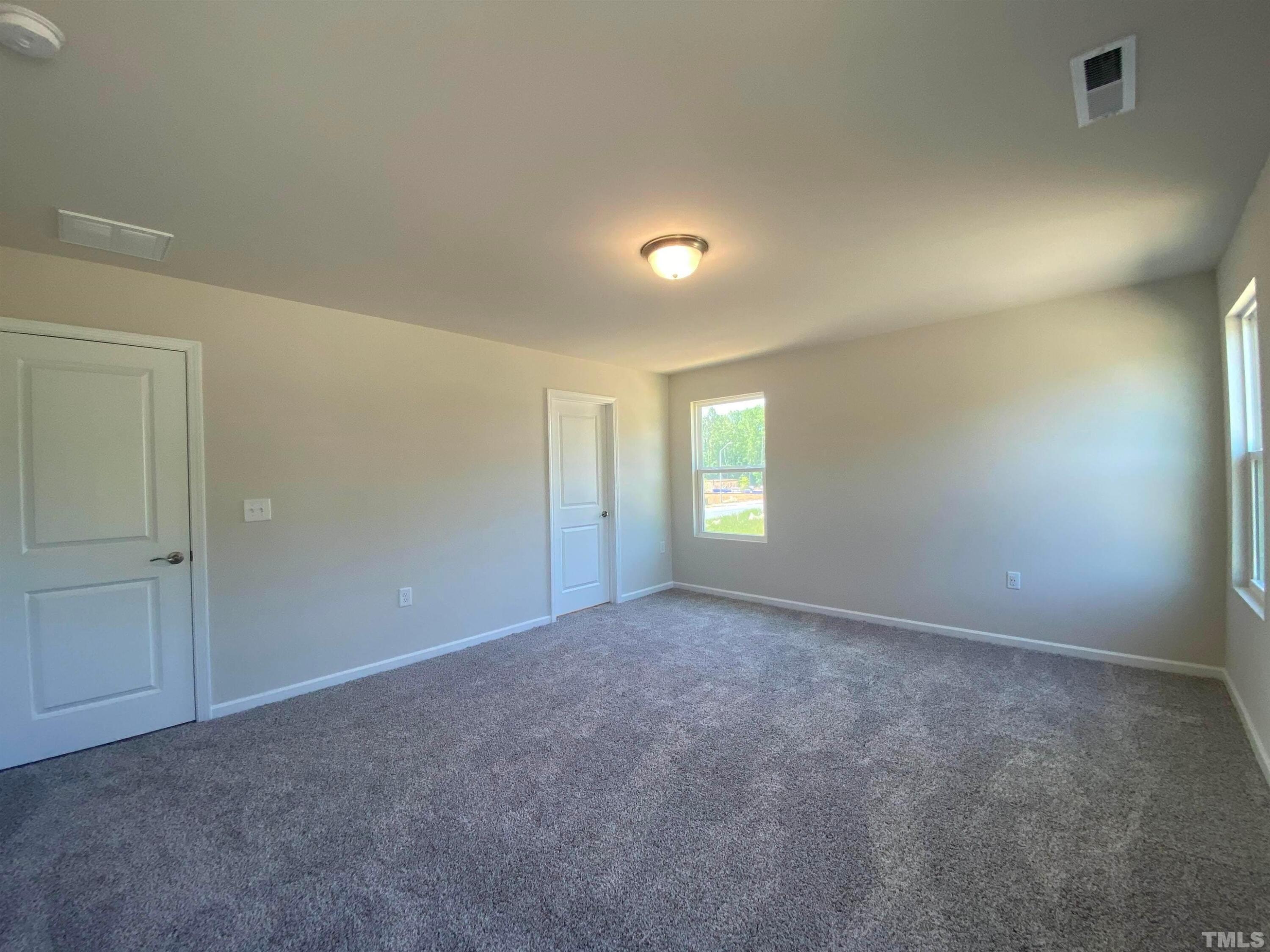 908 Clearhaven Lane Fuquay-Varina, NC 27526 - Photo 5 of 23 a view of an empty room and window