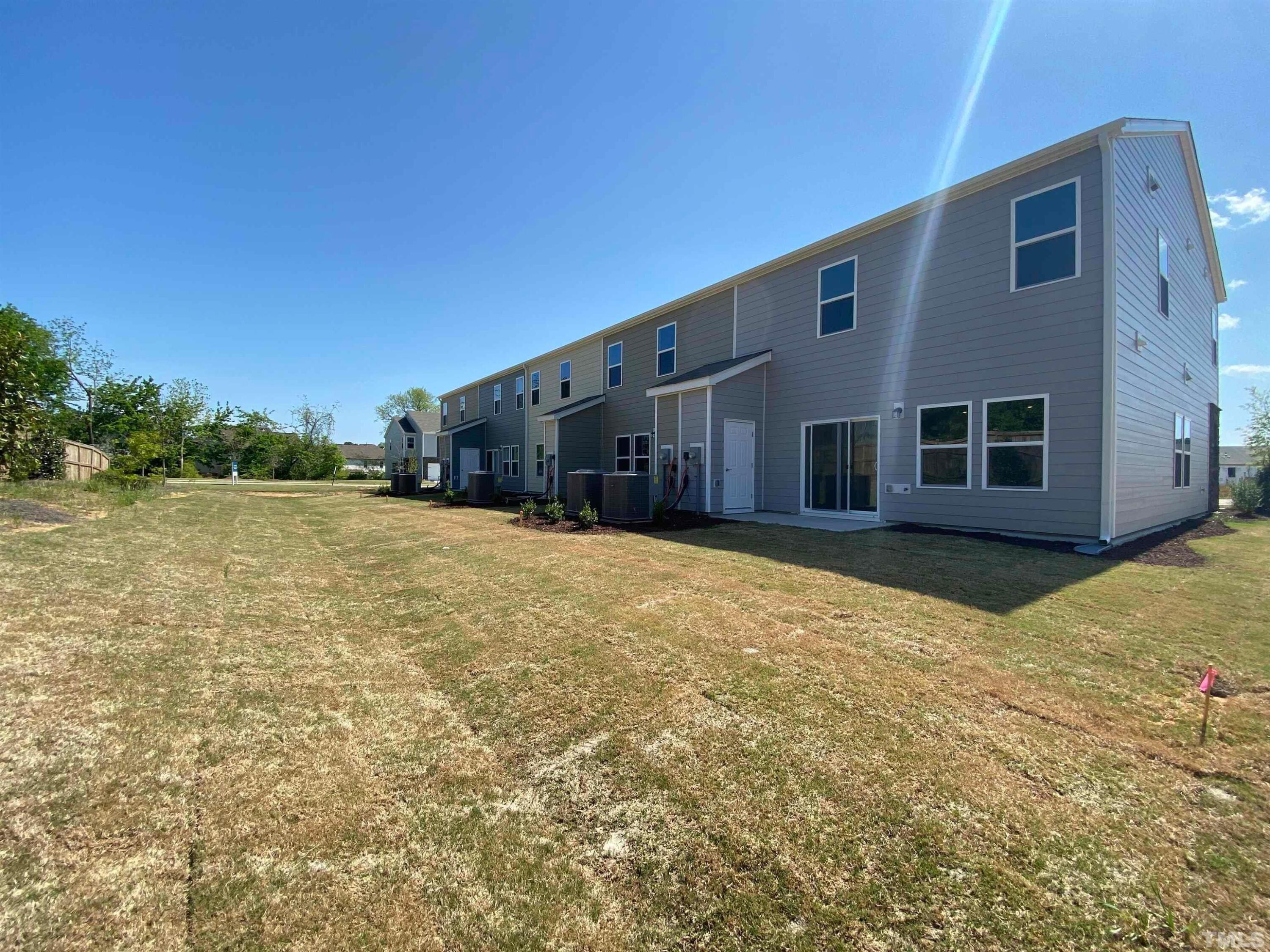 908 Clearhaven Lane Fuquay-Varina, NC 27526 - Photo 9 of 23 a front view of a house with a yard
