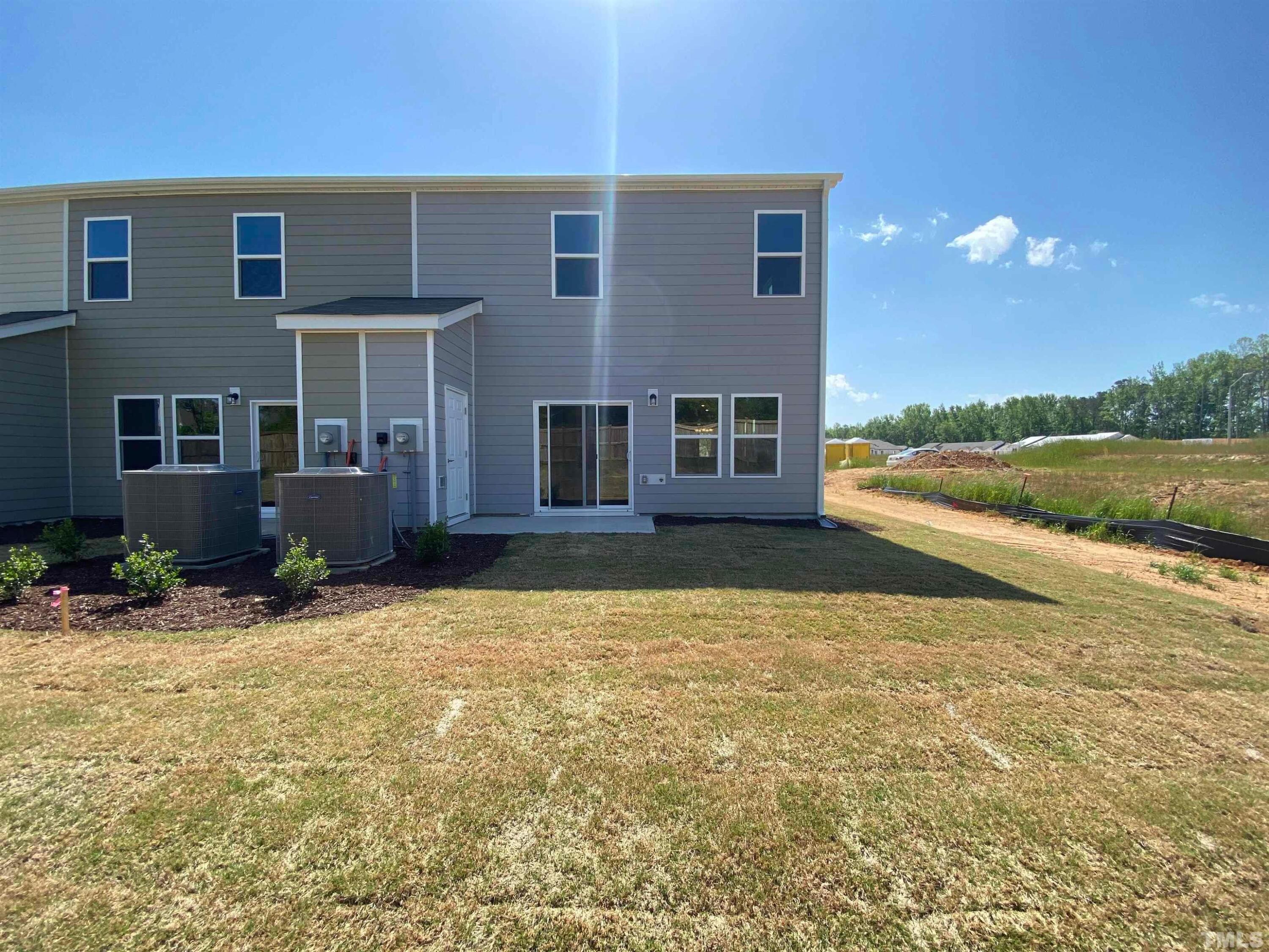 908 Clearhaven Lane Fuquay-Varina, NC 27526 - Photo 10 of 23 a view of an house with backyard and pool