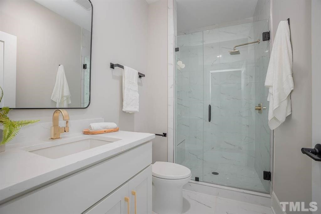 31 Treviso Place Durham, NC 27707 - Photo 11 of 21 a bathroom with a sink toilet and shower