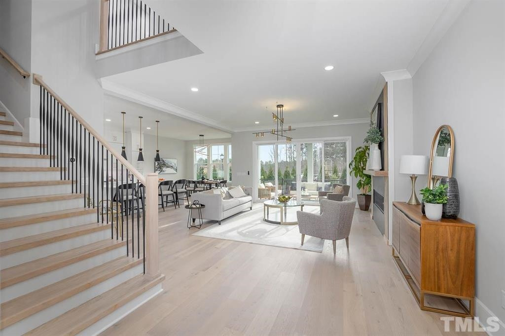 31 Treviso Place Durham, NC 27707 - Photo 6 of 21 a living room with furniture and a chandelier