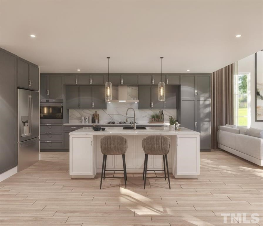 31 Treviso Place Durham, NC 27707 - Photo 7 of 21 a dining hall with stainless steel appliances granite countertop a sink a stove a refrigerator and island with wooden floor
