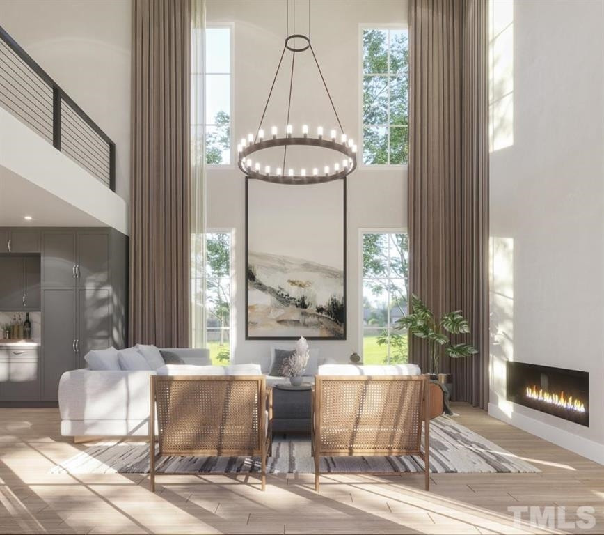 31 Treviso Place Durham, NC 27707 - Photo 9 of 21 a room with furniture and a chandelier