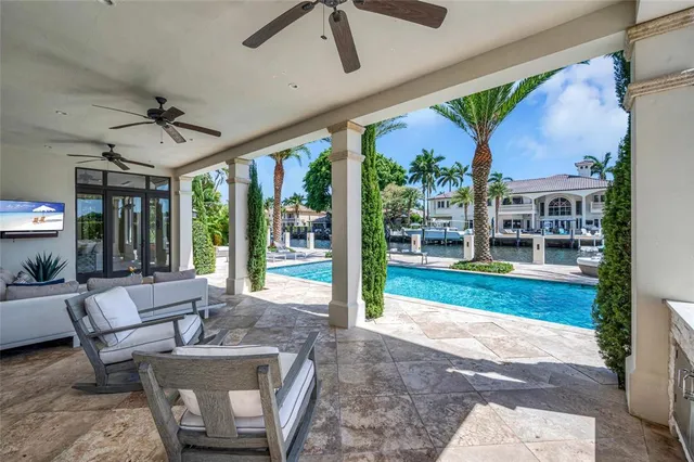 a patio with yard glass top table and chairs