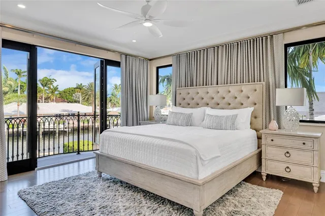 a bedroom with a large bed and a window