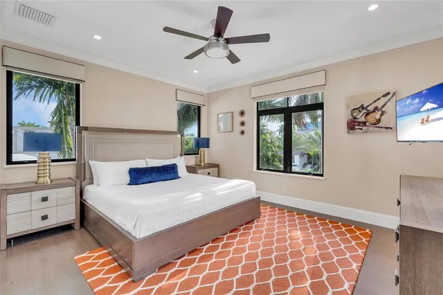 a bedroom with a large bed and a window