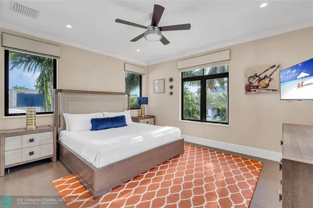 a bedroom with a large bed and a window