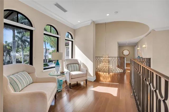 a living room with fireplace furniture and a large window