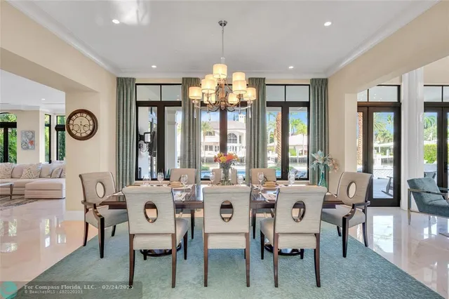 a very nice looking dining room with furniture window and outside view