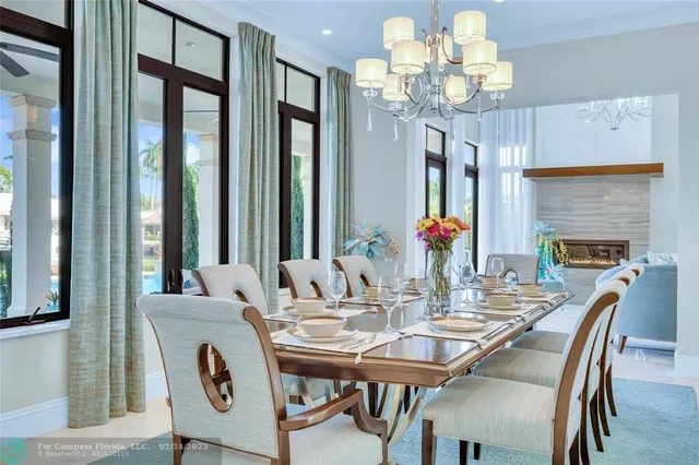 a view of a dining room with furniture wooden floor and chandelier