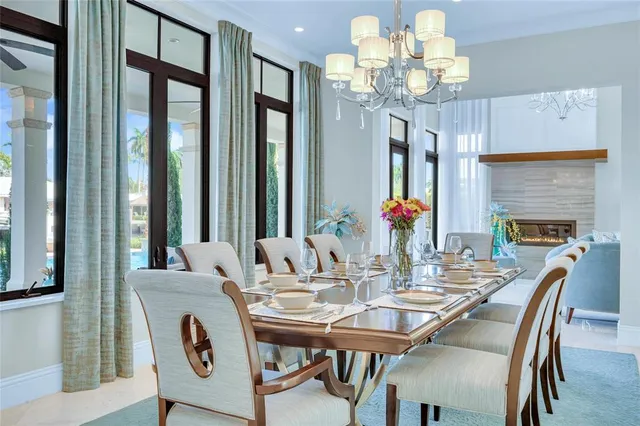 a view of a dining room with furniture wooden floor and chandelier