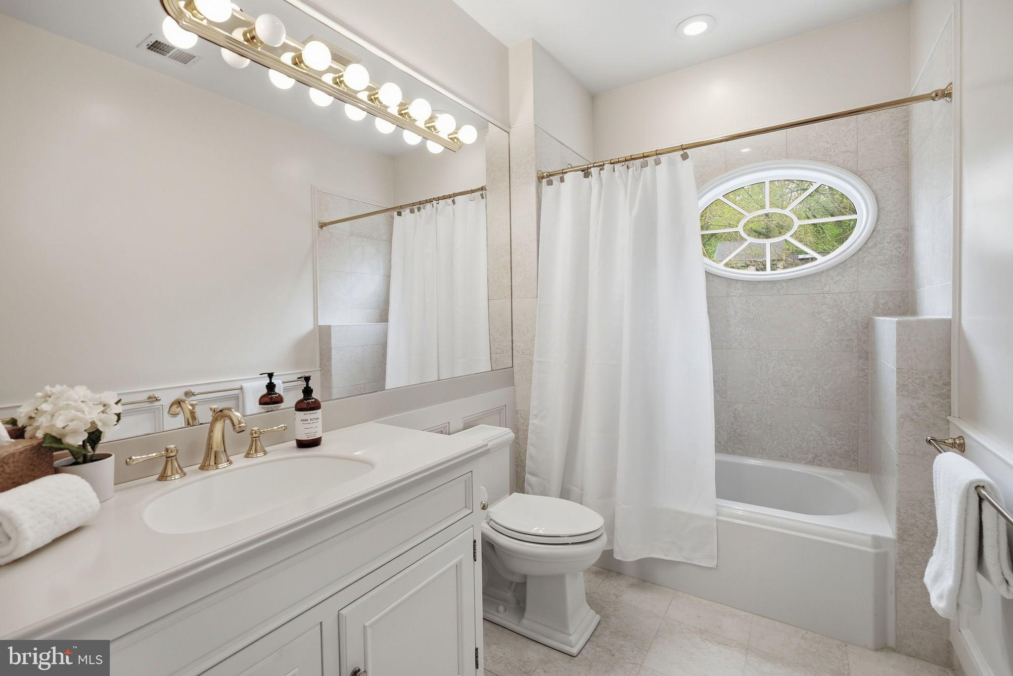 2318 Nebraska Avenue Northwest Washington, DC 20016 - Photo 18 of 28 a bathroom with a sink a toilet and shower