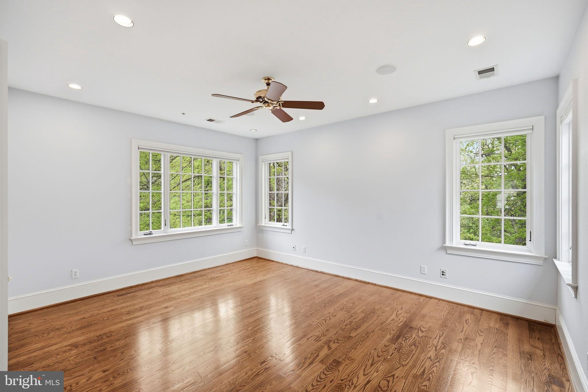 2318 Nebraska Avenue Northwest Washington, DC 20016 - Photo 19 of 28 a view of an empty room with wooden floor and a window