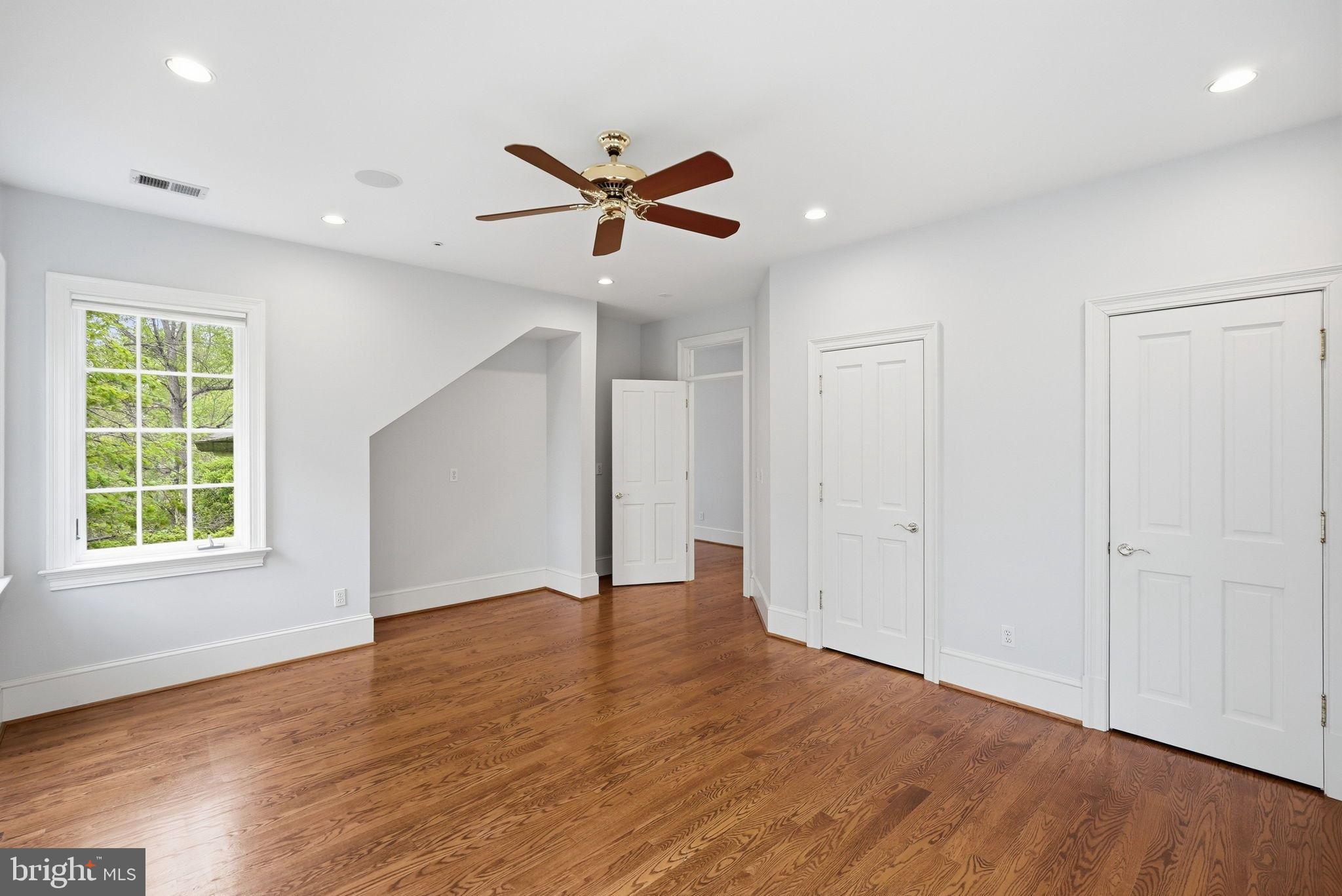 2318 Nebraska Avenue Northwest Washington, DC 20016 - Photo 20 of 28 a view of an empty room with wooden floor and window