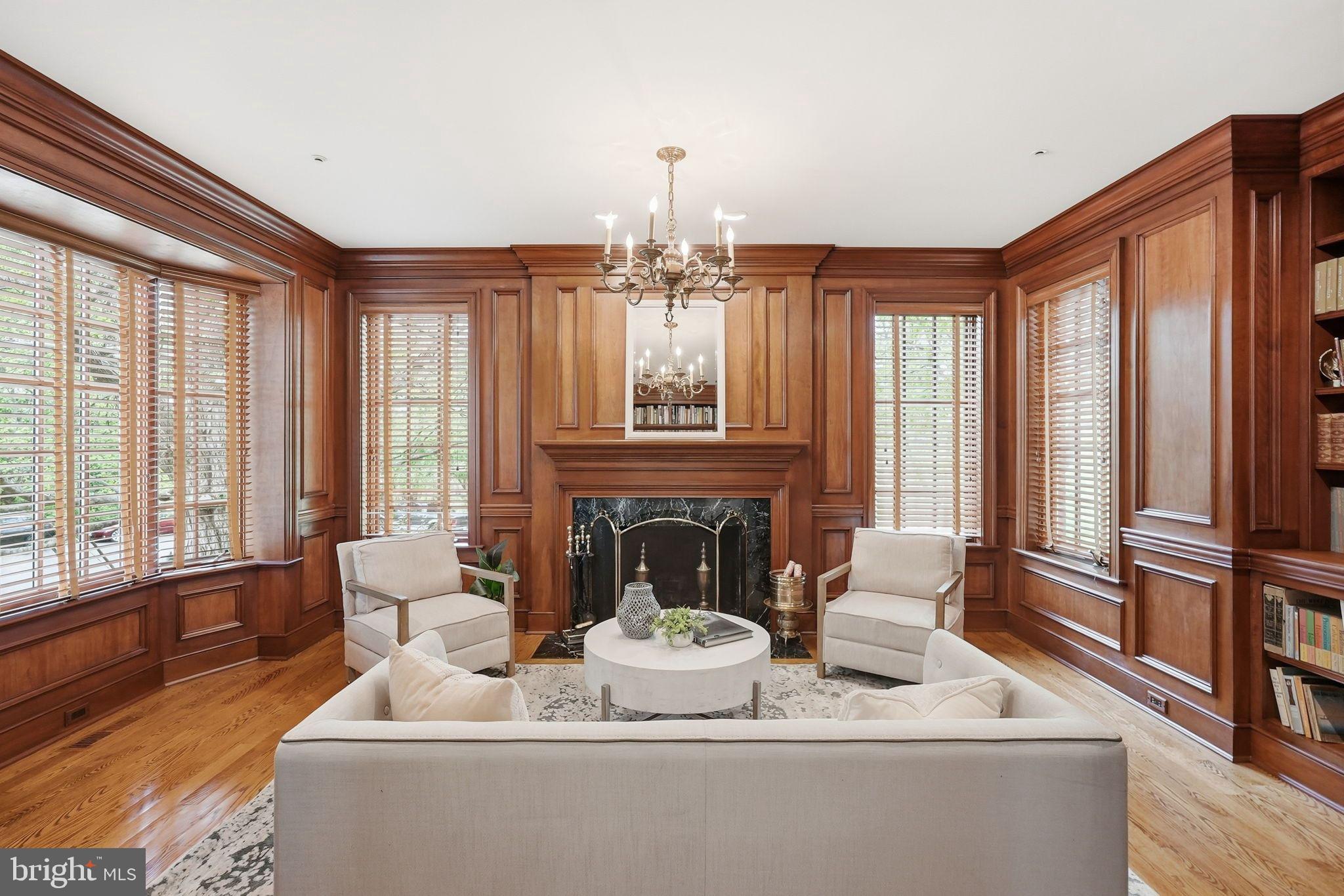 2318 Nebraska Avenue Northwest Washington, DC 20016 - Photo 2 of 28 a living room with furniture a fireplace and large windows