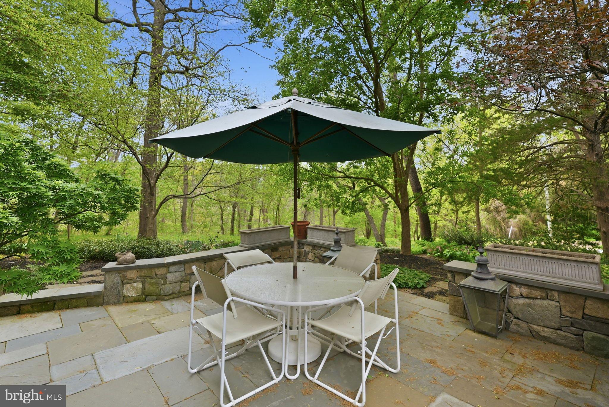 2318 Nebraska Avenue Northwest Washington, DC 20016 - Photo 26 of 28 a patio with a yard table and chairs