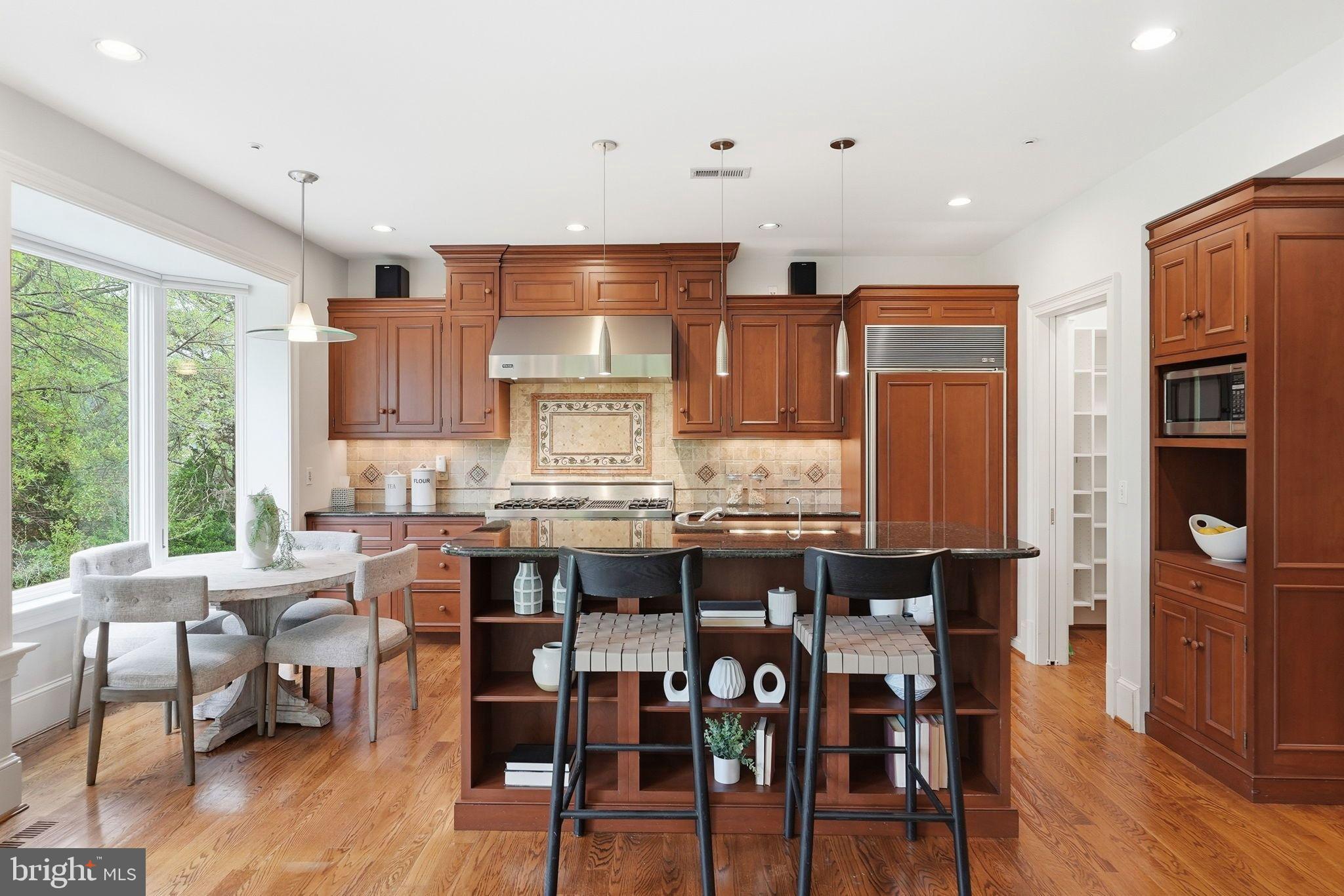 2318 Nebraska Avenue Northwest Washington, DC 20016 - Photo 6 of 28 a large kitchen with a table and chairs