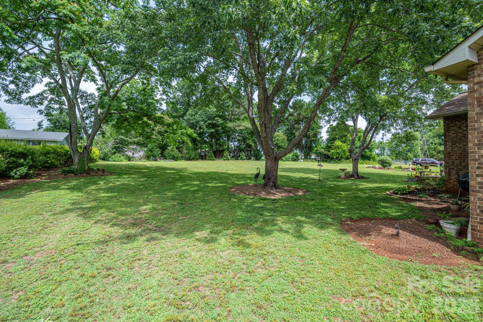 3815 Wildcherry Road Shelby, NC 28150 - Photo 32 of 33 a view of grassy field with benches and trees