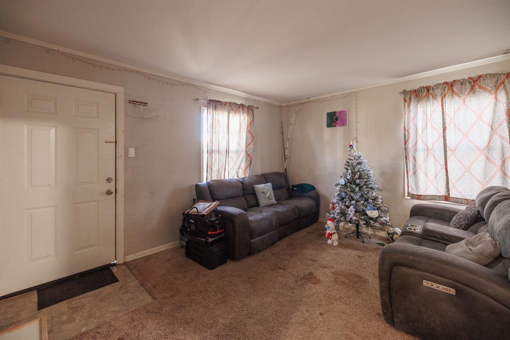 5349 Encino Road Abilene, TX 79605 - Photo 3 of 21 a living room with furniture and a large window