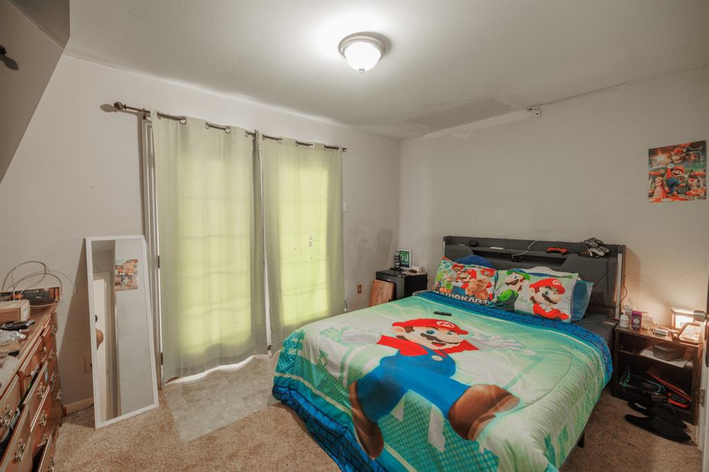 5349 Encino Road Abilene, TX 79605 - Photo 8 of 21 a bedroom with a bed and a dresser