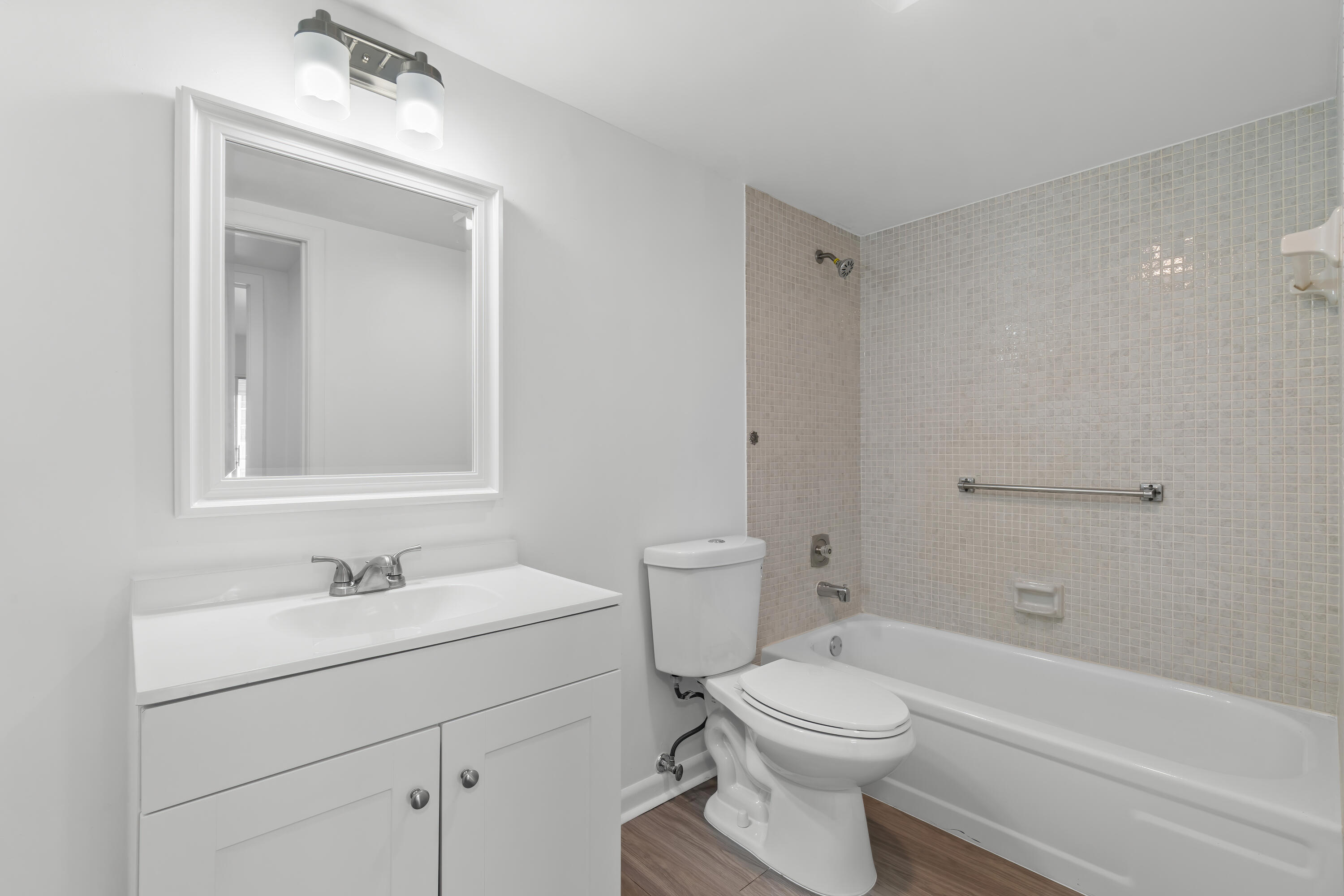 1007 Rexford Drive, Unit 1007 Boca Raton, FL 33434 - Photo 13 of 21 a bathroom with a sink a toilet and shower