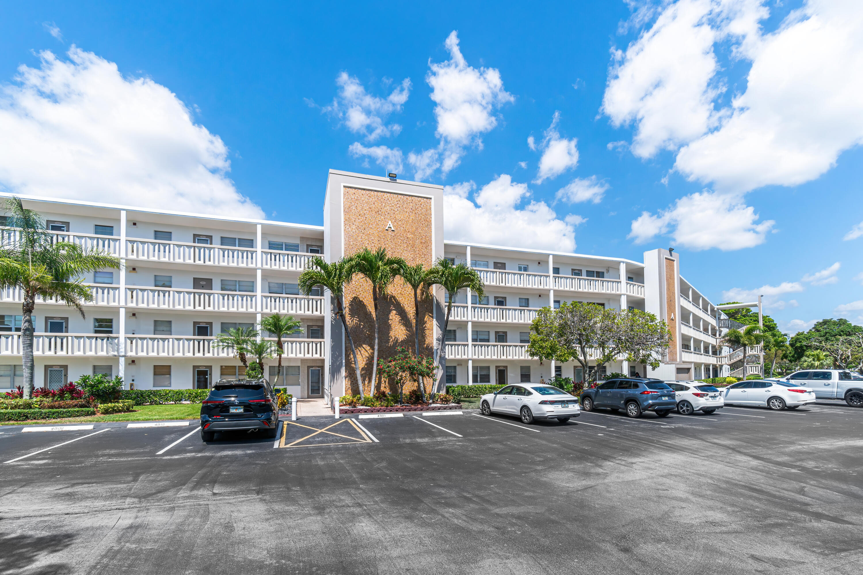 1007 Rexford Drive, Unit 1007 Boca Raton, FL 33434 - Photo 20 of 21 a view of a street with a building