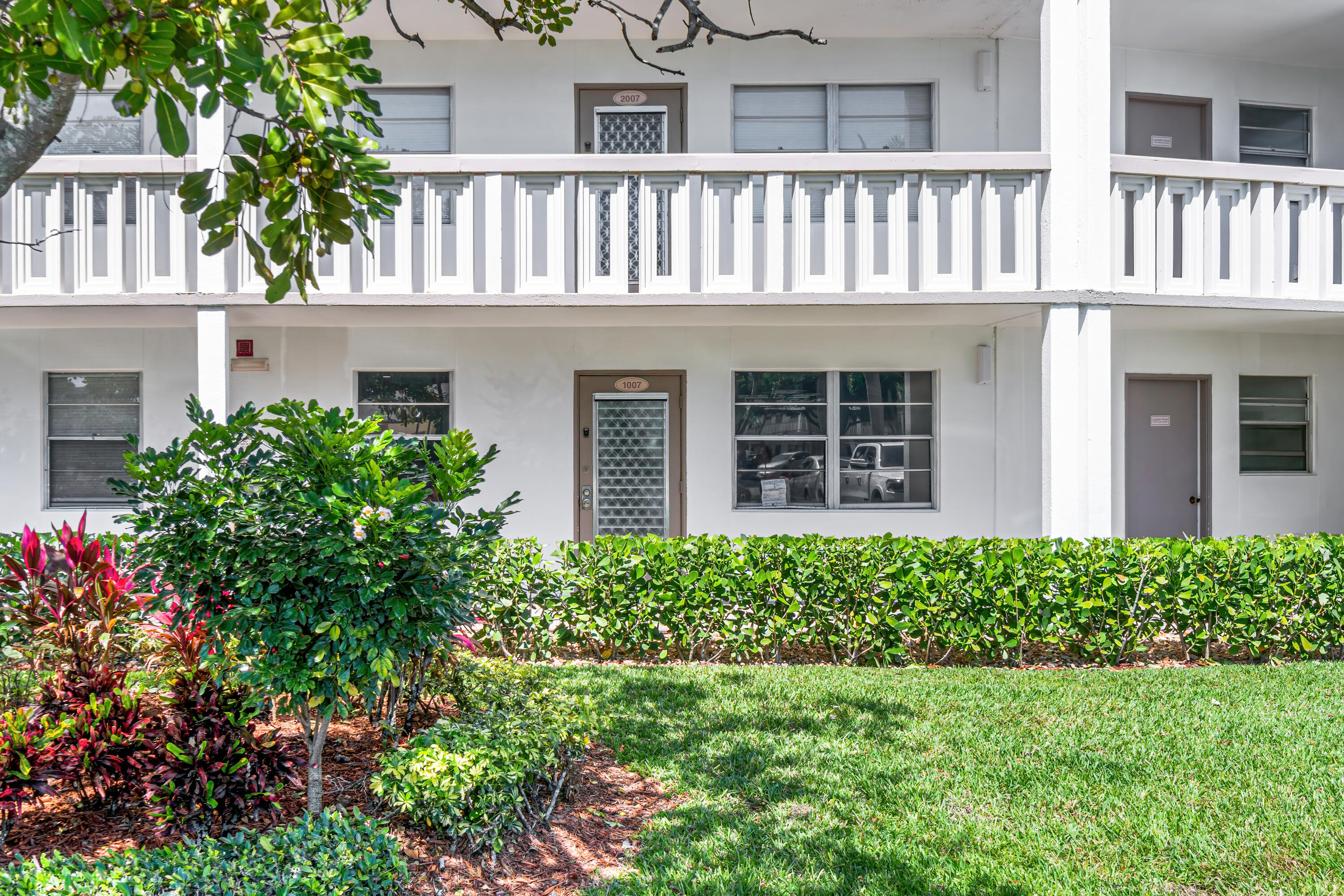 1007 Rexford Drive, Unit 1007 Boca Raton, FL 33434 - Photo 21 of 21 a house view with a garden space