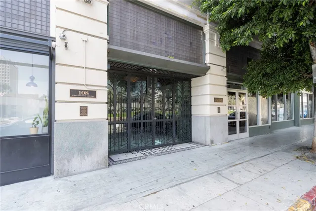 a view of a tall building next to a road