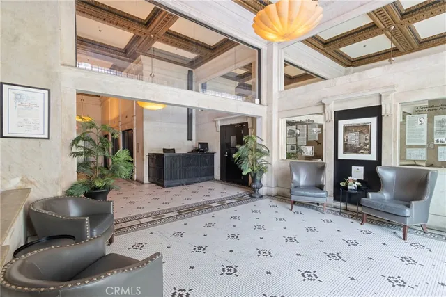 a city street with tall buildings in the background