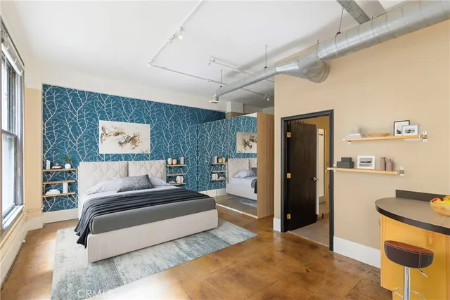 a living room with furniture and a rug