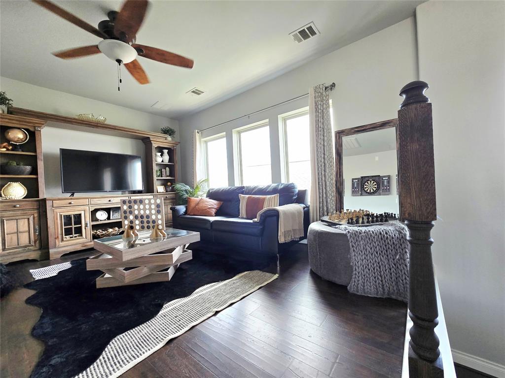 242 Freeman Loop Liberty Hill, TX 78642 - Photo 11 of 25 Living area with dark wood-style flooring and ceiling fan