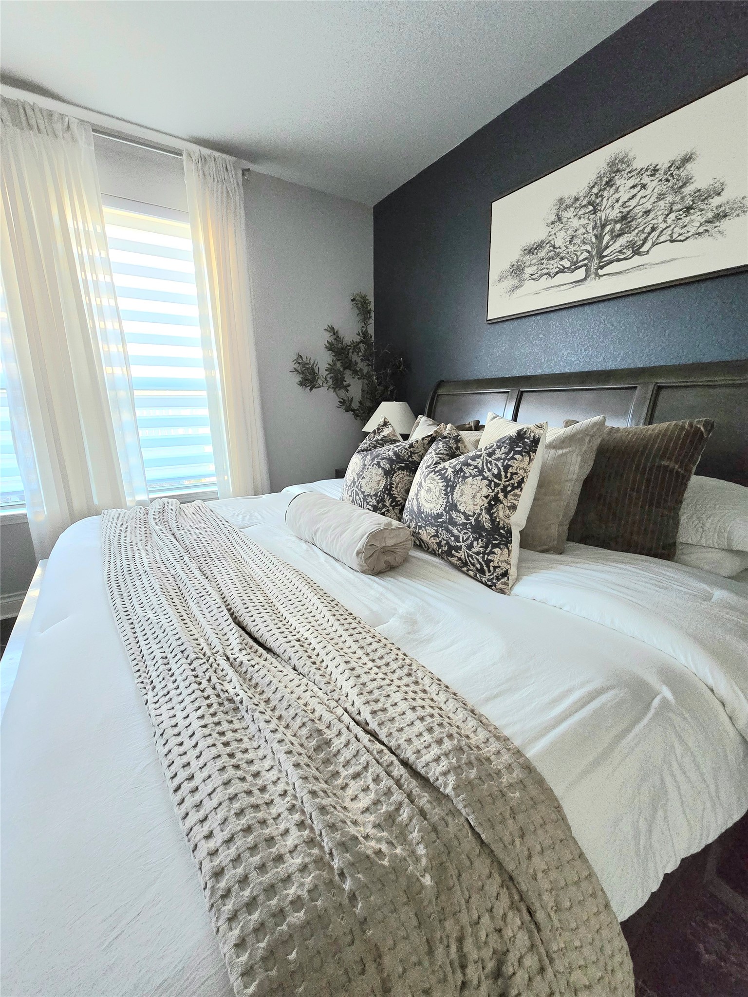 242 Freeman Loop Liberty Hill, TX 78642 - Photo 15 of 27 a bedroom with a bed and wooden floor