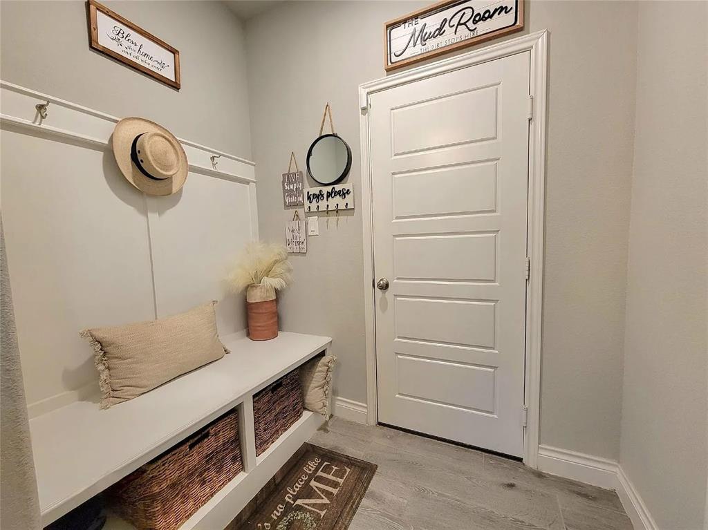 242 Freeman Loop Liberty Hill, TX 78642 - Photo 19 of 27 a view of hallway with washer and dryer