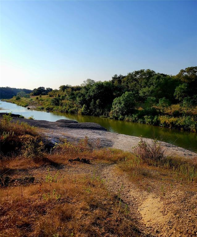 242 Freeman Loop Liberty Hill, TX 78642 - Photo 22 of 25 Water view featuring a heavily wooded area
