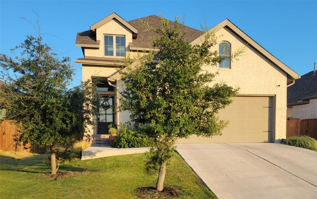 242 Freeman Loop Liberty Hill, TX 78642 - Photo 24 of 27 a view of house with garden space and swimming pool