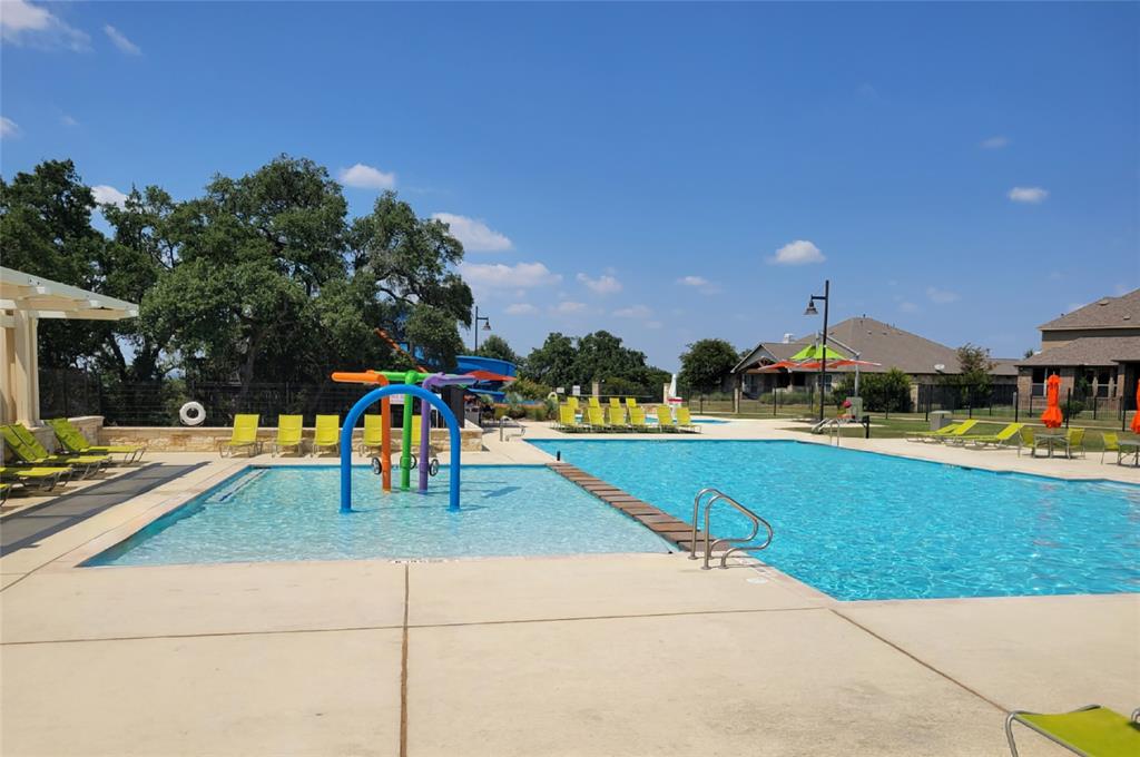 242 Freeman Loop Liberty Hill, TX 78642 - Photo 27 of 27 a view of outdoor space with swimming pool and patio