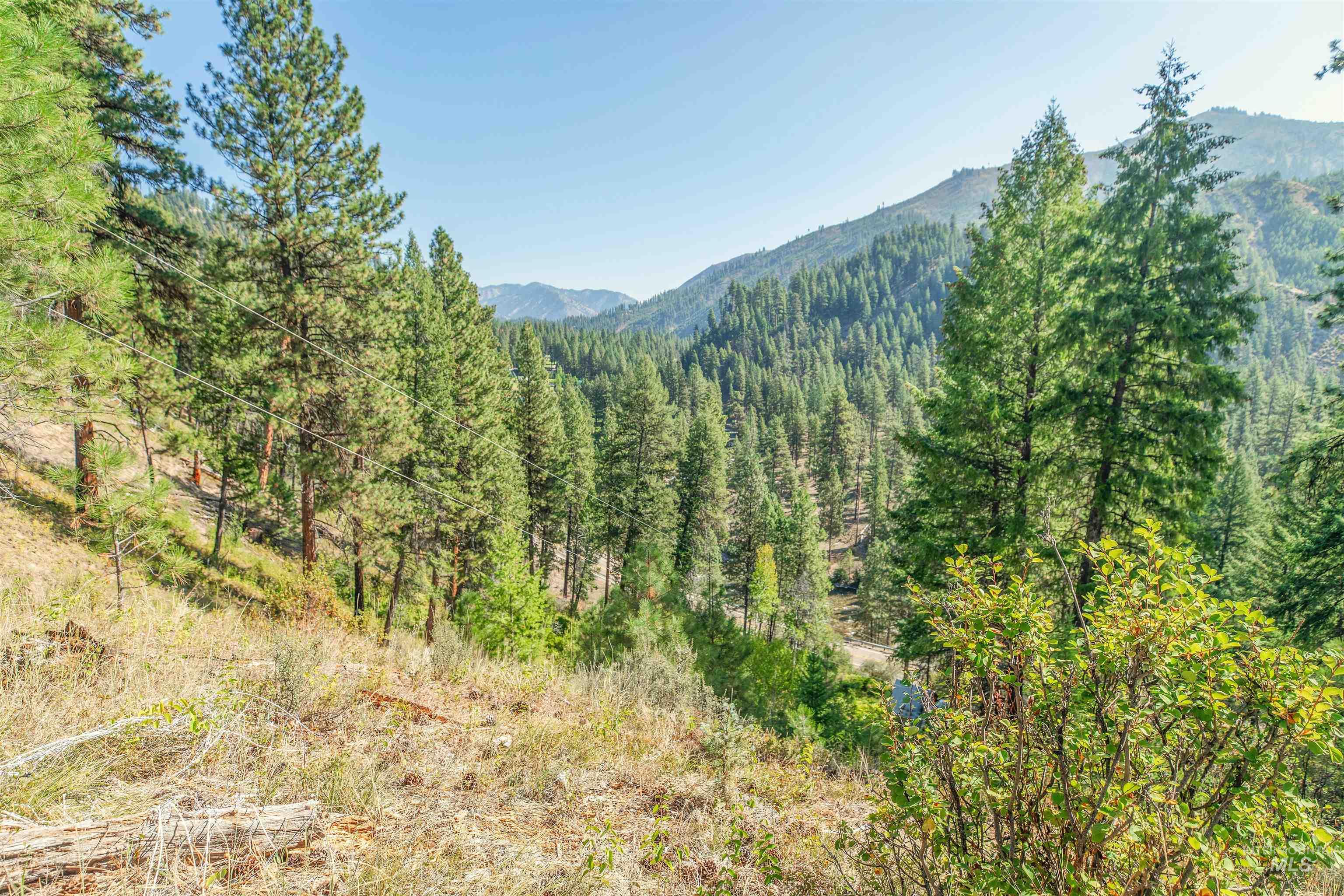 12 Plateau Road Lowman, ID 83637 - Photo 16 of 32 Mountain view with a heavily wooded area. look below and you will see HWY 21. The South Fork of the Payette River follows along this HWY