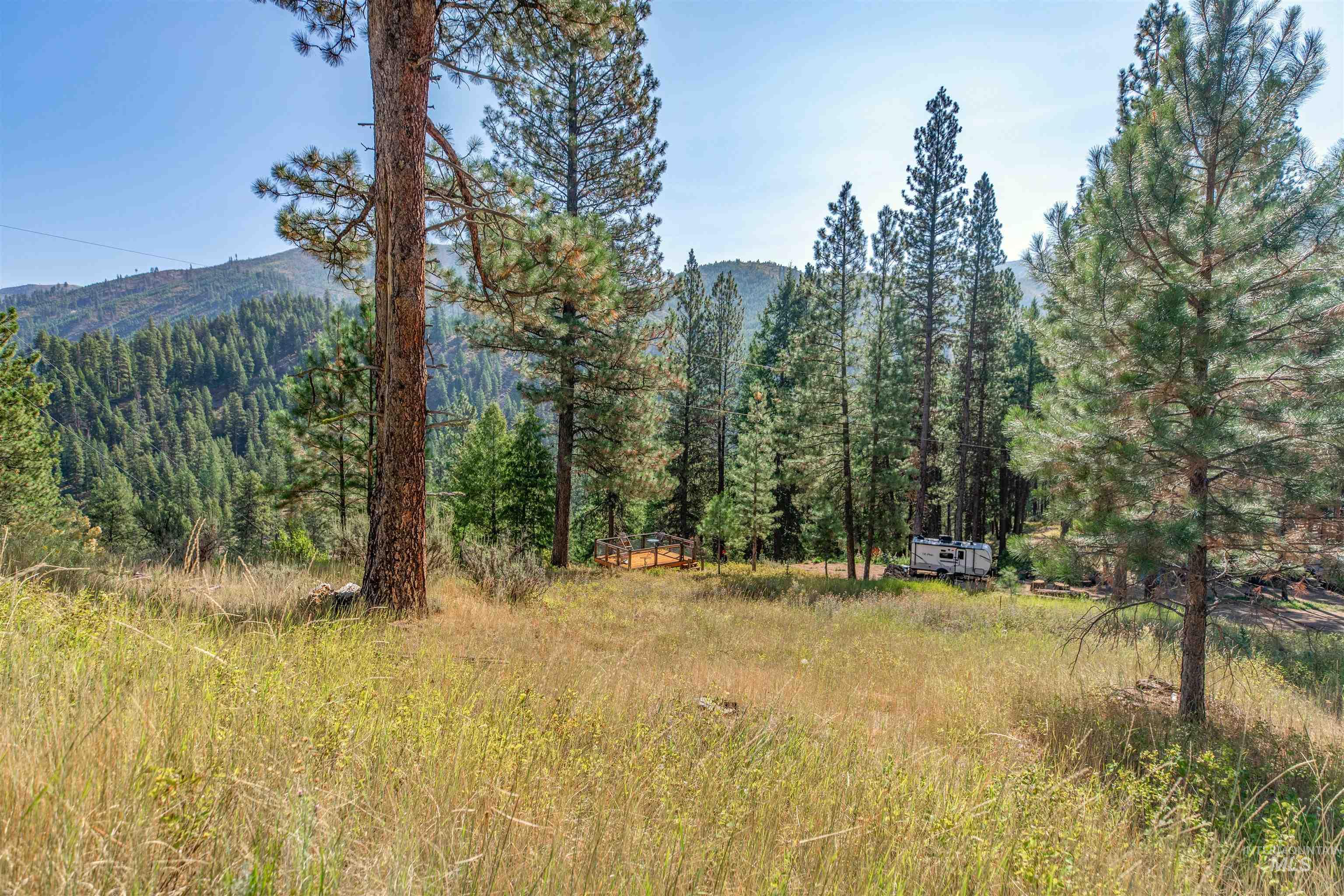 12 Plateau Road Lowman, ID 83637 - Photo 6 of 32 The boundary of the property runs parallel to the camper