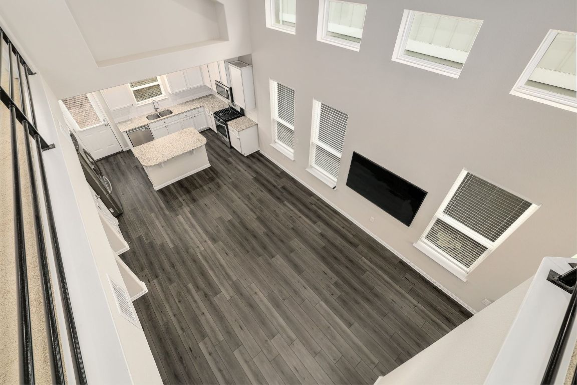 10709 Blacket Drive Austin, TX 78747 - Photo 7 of 27 a view of living room and dining room with wooden floor