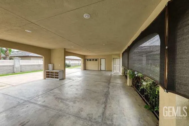 an aerial view of residential house with outdoor space and parking