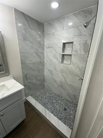 a bathroom with a sink a toilet a mirror and vanity