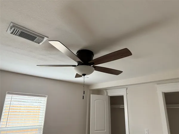 a view of a small space with wooden floor