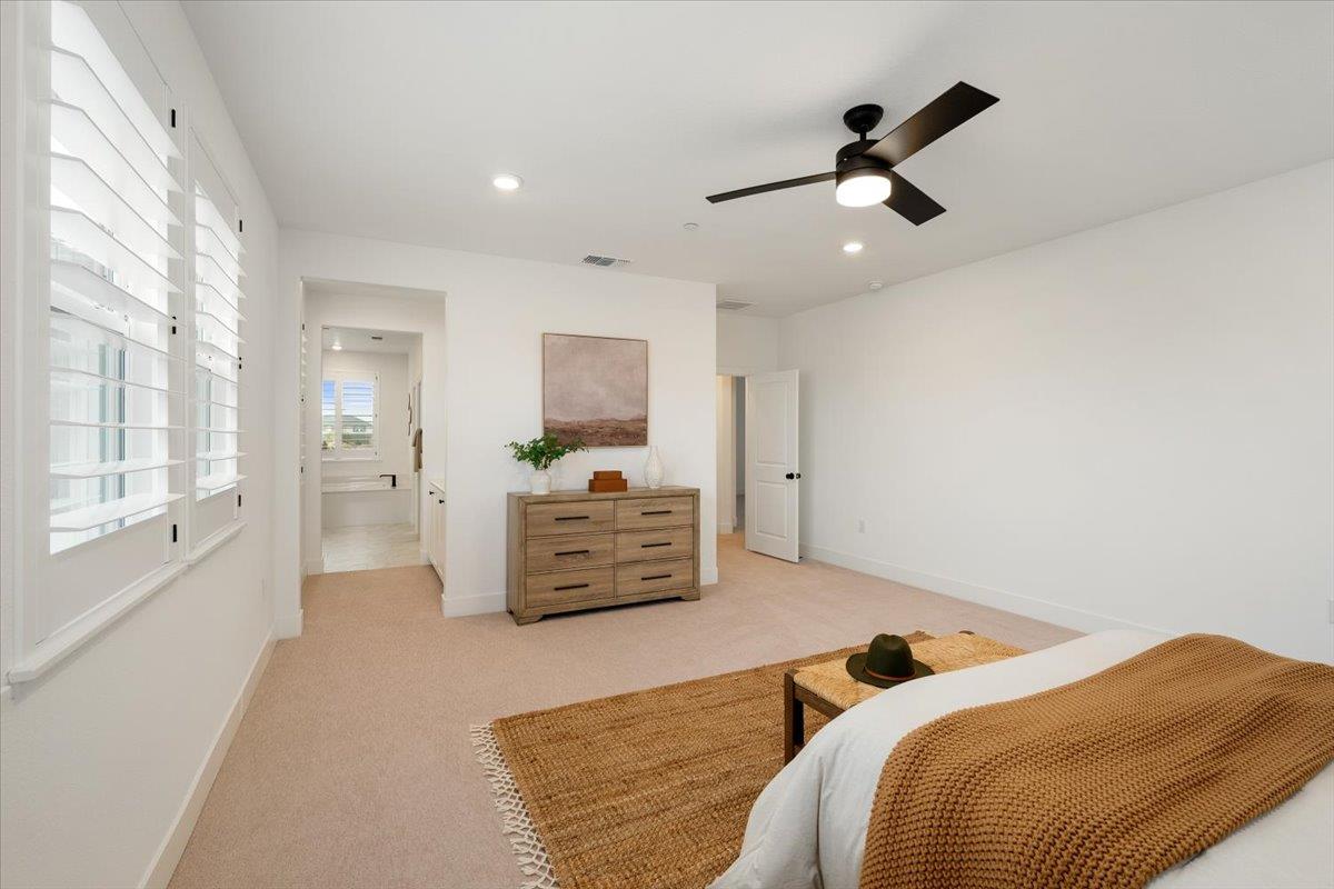 280 Vectra Court Roseville, CA 95747 - Photo 17 of 84 a bedroom with a bed and a chandelier